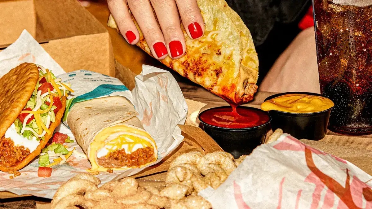 Taco Bell introduces Grilled Cheese Dipping Taco on Aug 3, featuring fried taco shell with grilled cheese, slow-braised beef, jalapeño sauce, and 3 cheeses.