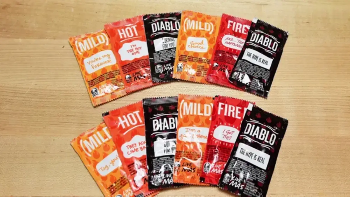 Members of the Taco Bell Rewards program can choose new spicy sauce sayings for a 2024 rollout by voting on the current selections.
