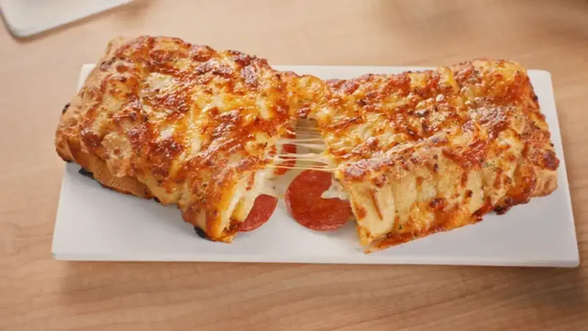 New at Domino's: Pepperoni-Stuffed Cheesy Bread! Get the perfect blend of cheese, pepperoni, and flavor in every bite. Order now!
