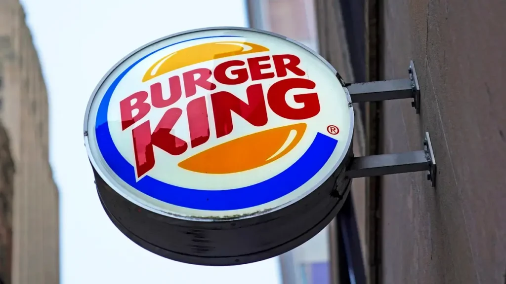 Burger King to Face Lawsuit Over 'Misleading' Whopper Size: Accused of showing larger burgers on menus than reality. Fast food chain disputes claims.