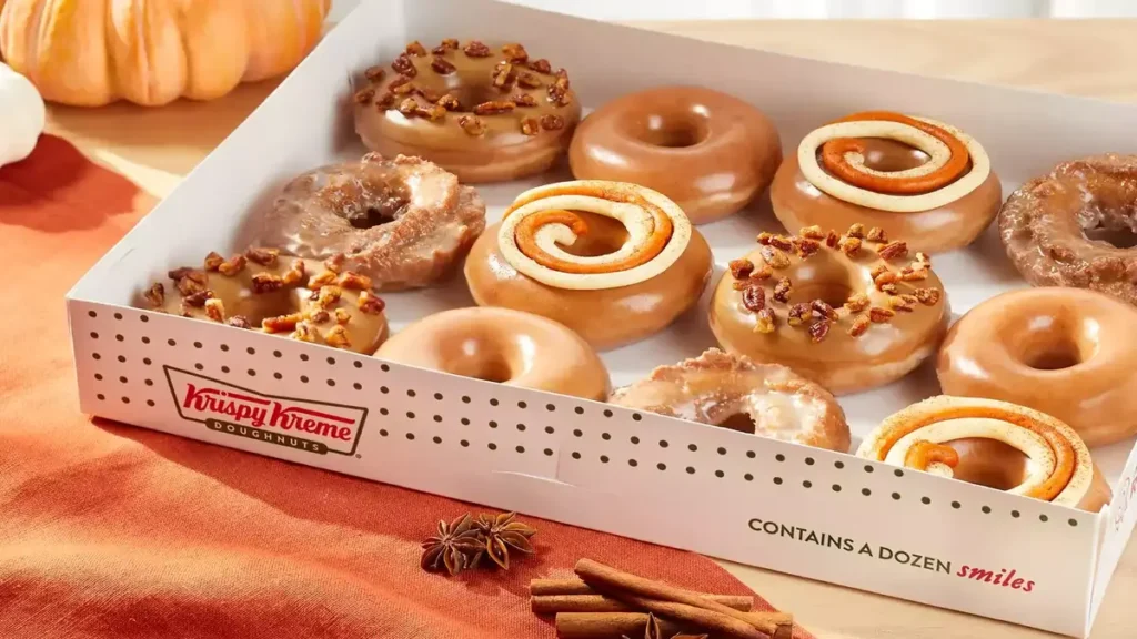 Krispy Kreme's Fall Menu: New Pumpkin Spice Donuts & Classics Return! Indulge in pumpkin spice lattes, cake, and cheesecake swirl delights.