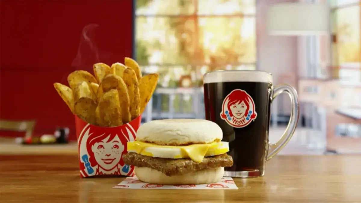 Try Wendy's new English Muffin Sandwiches with spicy buttery spread. Get $2 off any Breakfast Combo in the app till Sept 3. Delicious mornings await!